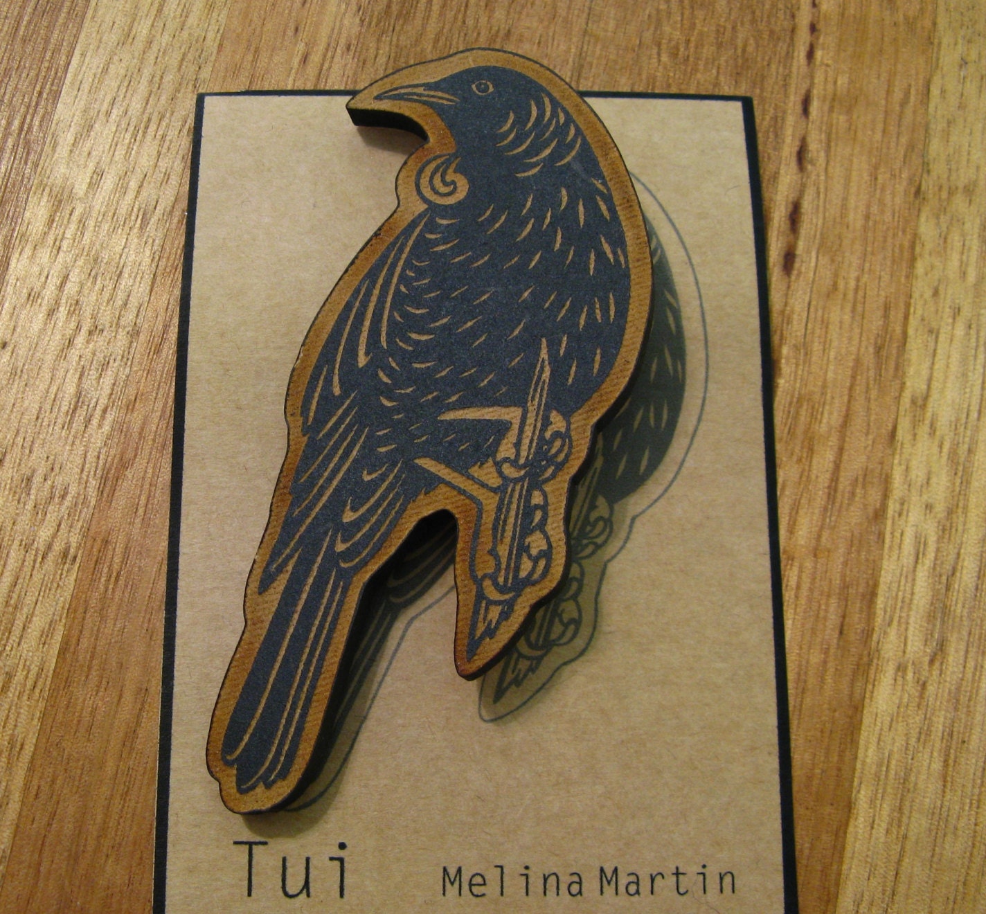 Tui Brooch